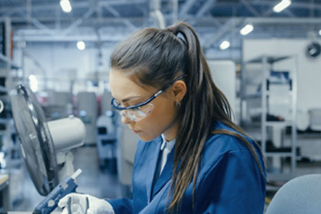 Woman working on medical device assembling